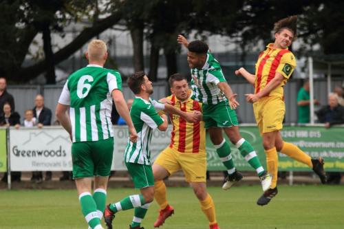 Enfields Sam Youngs (R) is penalised for a push on Ryan Davidson