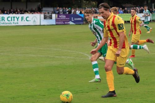 Enfields Sam Youngs and Chichesters Jamie Horncastle (green)
