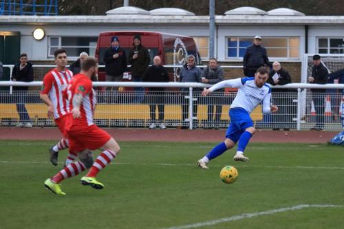 Enfields Billy Bricknell (R) cuts the ball into the penalty area but Cullum Leahy clears for a corner