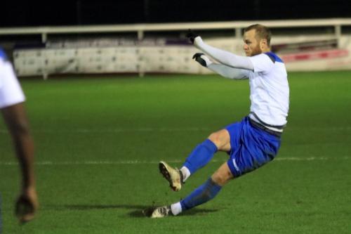 Enfields Sam Hatton looses his footing while crossing the ball