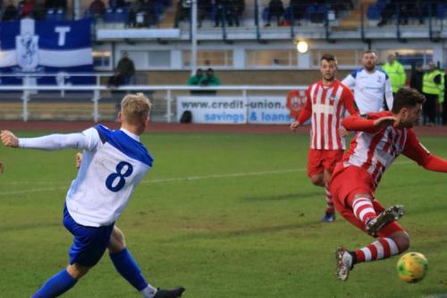 Ryan Blackman shoots past Jamie Dicks attempted block but hits a teammate in an offside position