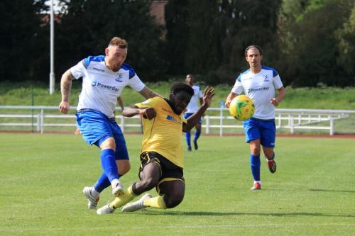 Enfields Billy Bricknell (L) shoots as Ben Acquaye tries to block