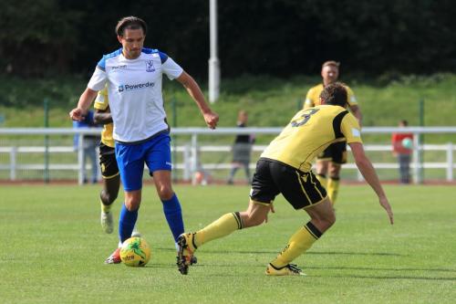 Enfields Sam Youngs (L) and Rushdens Sam Brown