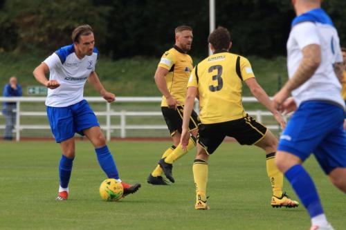 Enfields Sam Youngs and Rushdens Sam Brown (3) and Ryan Dove