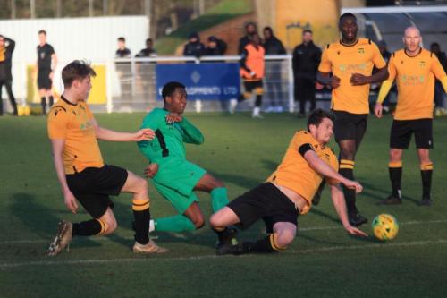 Cheshunts Adam Crowther (L) and Sean Cronin try to block Ken Charles shotx