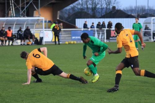 Cheshunts Sean Cronin (6) tackles Ken Charlesx