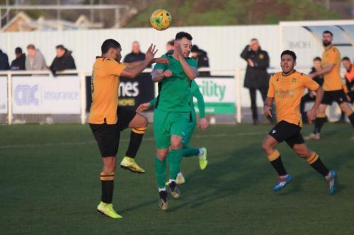 Cheshunts Tanasheh Abrahams (L) challenges Lyle Della-Verdex