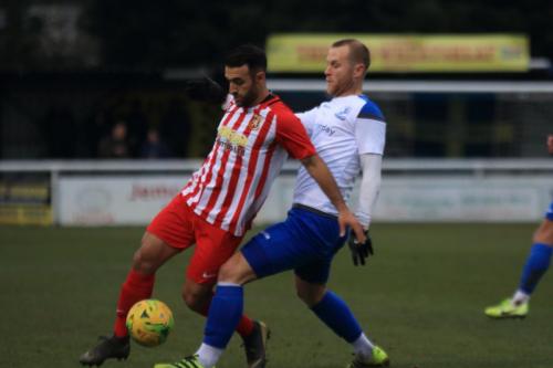 Enfields Sam Hatton (R) challenges Kieron McCann