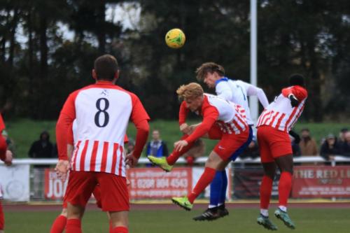 Enfields Sam Youngs (white) challenges Finn OMara (yellow boots) and Ira Jackson