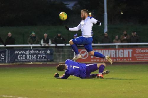 Folkestone keeper Henry Newcombe saves at the feet of Billy Bricknell
