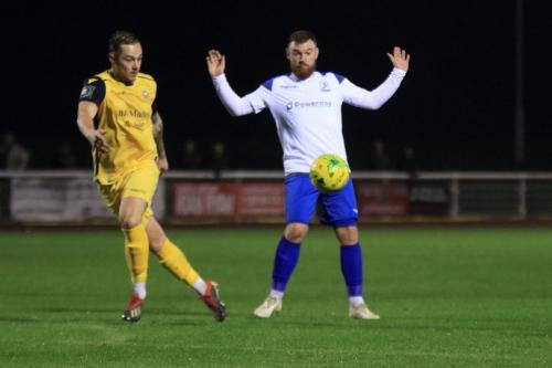 Enfields Billy Bricknell, in an offside position, tries to persuade the officials that he isnt distracting Arthur Lee