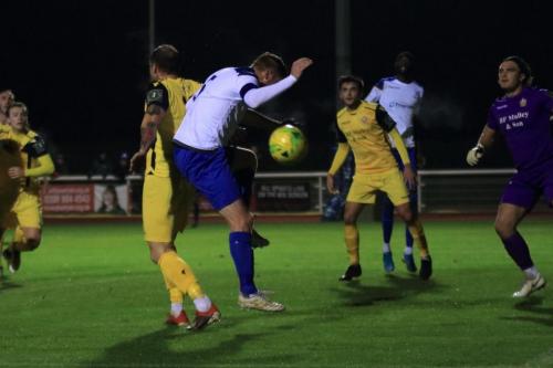 Enfields Marc Weatherstone (white) challenges Arthur Lee