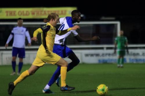 Hornchurchs George Winn (L) and Enfields Muhammadu Faal