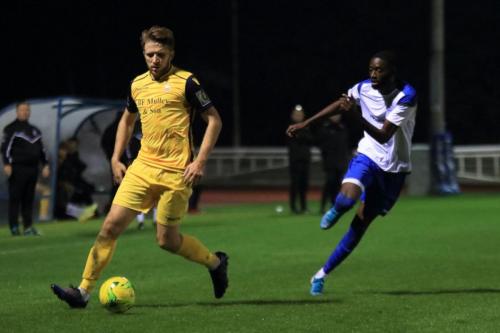 Hornchurchs Remi Sutton (L) and Enfields Muhammadu Faal