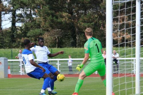Enfields Ken Charles (L) and Junior Mubiayi just fail to get the final touch
