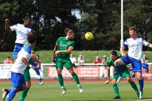 Enfields Ken Charles (L) heads goalwards