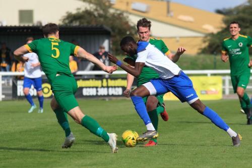 Enfields Muhammadu Faal runs at Charlie Harris and Ben Dyett (5)