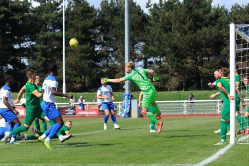 Horsham keeper George Bentley punches clear