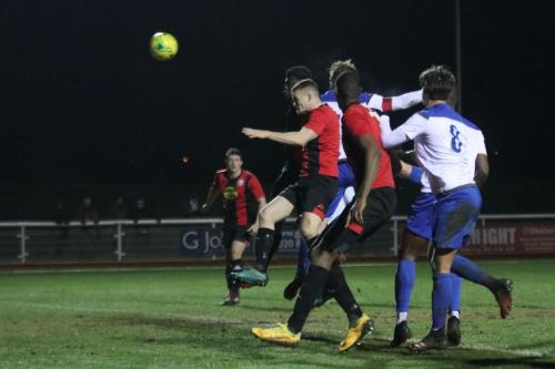 Enfield captain Marc Weatherstone (red armband) heads the equalising goal