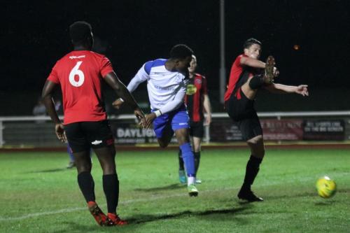 Enfields Ken Charles (white) forces a save from the Lewes keeper