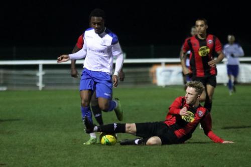 Lewes Tegan Freeman tackles Ken Charles (L)