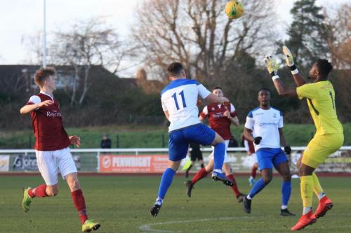 Bognor keeper Amadou Tangara collects under pressure from Lyle Della-Verde