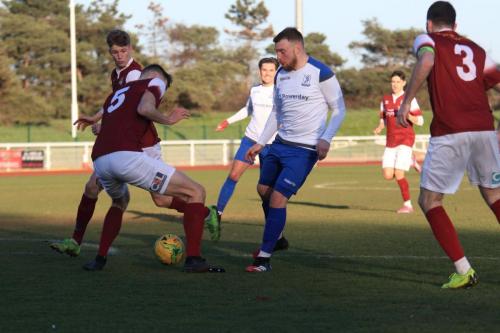 Bognors Matt Casey (5) tackles Billy Bricknell