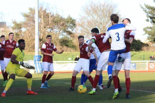 Enfields Josh Urquhart (3) challenegs at a corner