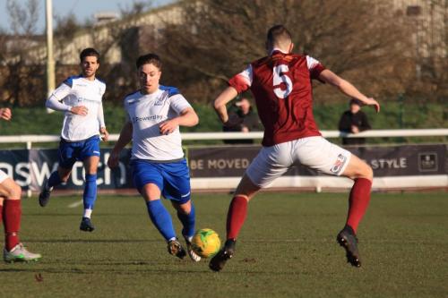 Enfields Lewis Taaffe and Josh Urquhart (L) and Bognors Matt Casey