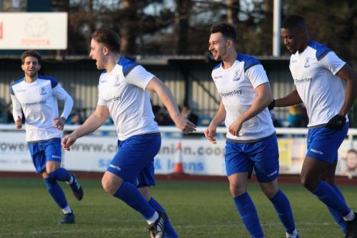 Lewis Taaffe (2nd L) celebrates his goal