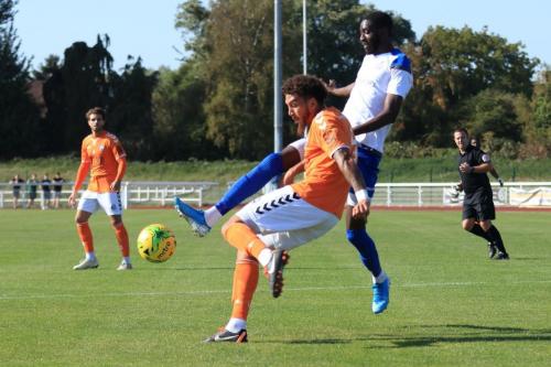 Braintrees Harry Osborne (L) clears from Muhammadu Faal