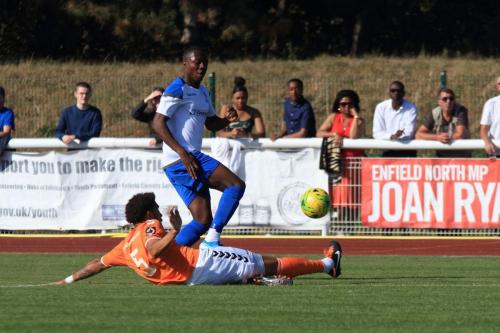 Braintrees Harry Osborne (orange) clears from Ken Charles