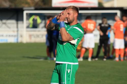 Enfield keeepr Nathan McDonald celebrates at the end of the game