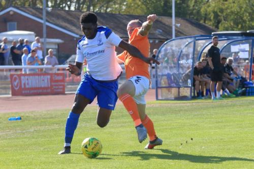 Enfields Charles Brown (L) and Braintrees Adam Mills