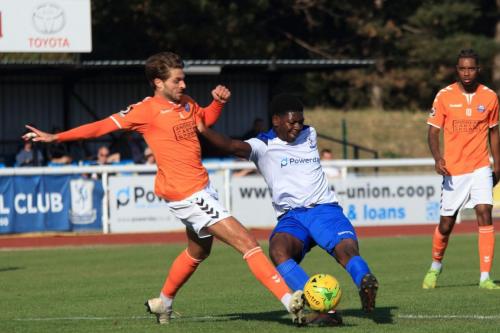 Enfields Charles Brown shoots as Josh Urquhart (L) tries to block