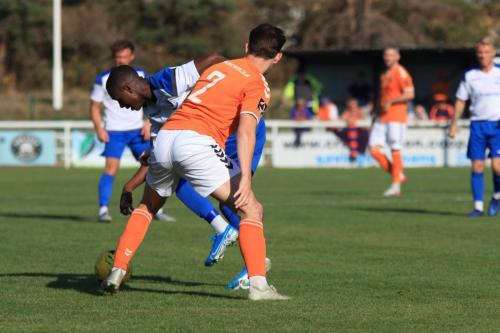 Enfields Ken Charles runs at Harry Donovan (orange)
