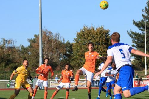Enfields Marc Weatherstone (R) heads across goal