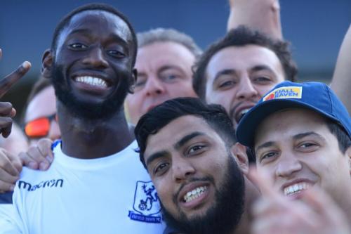Enfields Muhamamdu Faal celebrates with some fans