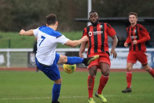 Enfields Lyle Della-Verde plays an air shot to an attempted volley