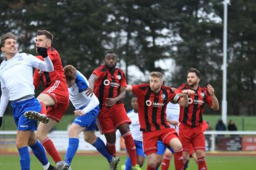 Enfields Sam Youngs (far L) and Marc Weatherstone challenge at a set piece