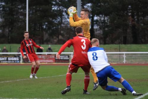 Regent keeper Charlie Turner catches the ball ahead of teammate Jake Gould (3) and Ryan Blackman