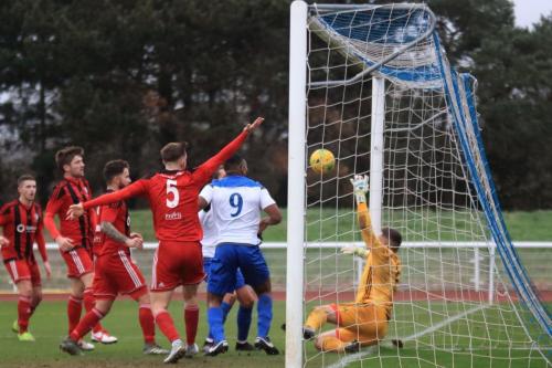 Regent keeper Charlie Turner claws Sam Youngs header away before it crosses the line but Youngs scores from the rebound