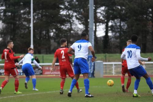Regents Matt Cripps (behine Enfield no 10 Ken Charles) clears Marc Weatherstones shot