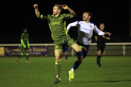 Carshaltons Luke Read (L) heads clear from Scott Thomas