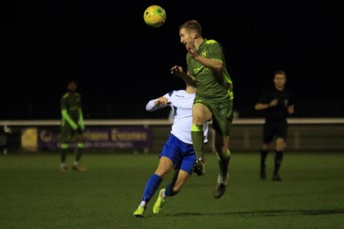 Carshaltons Luke Read heads clear from Scott Thomas