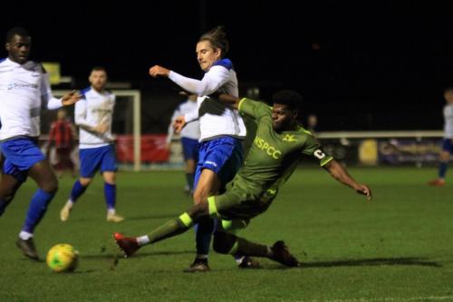 Carshaltons Paris Hamilton-Downes (R) tackles Sam Youngs