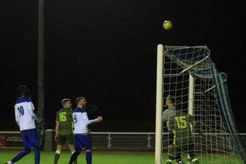 Marc Weatherstone (out of picture) heads just over from an Enfield corner