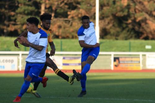 Enfields Jon Muleba (R) shoots after a run from the right back position