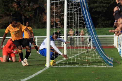 Enfields Ken Charles appears to get the final touch to Muhammadus shot for the opening goal