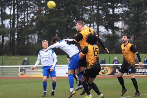 Crays Tom Phipp (amber) heads clear from Josh Urquhart
